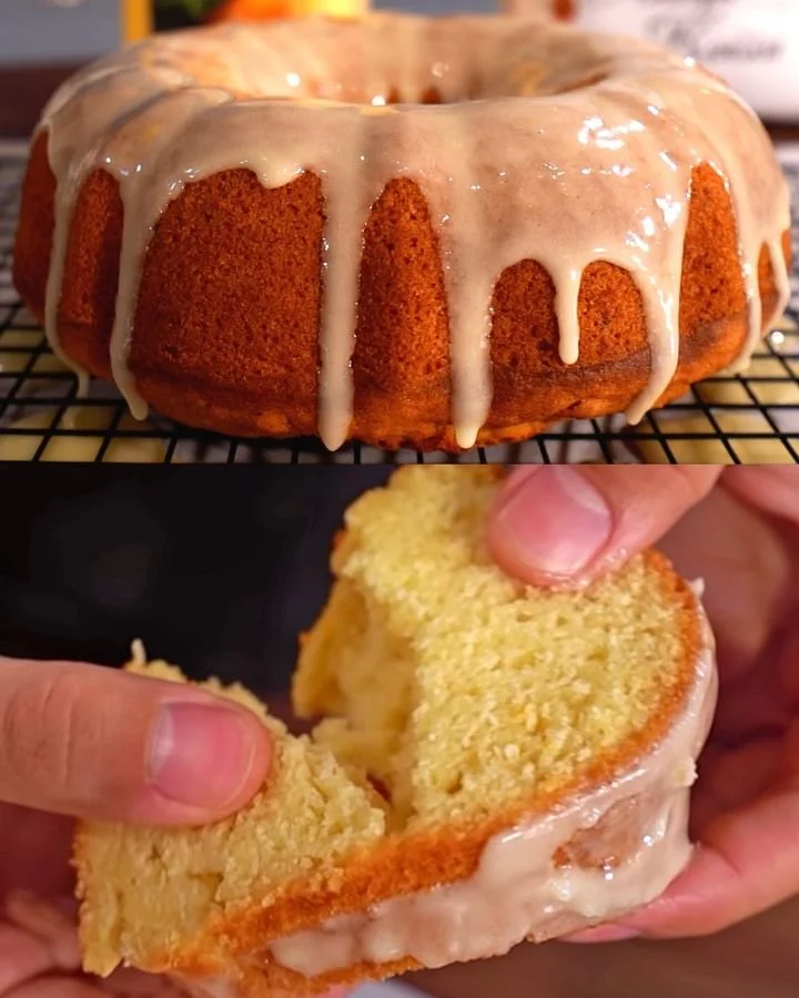 Pastel de libra de naranja sobre una mesa con decoración de frutas
